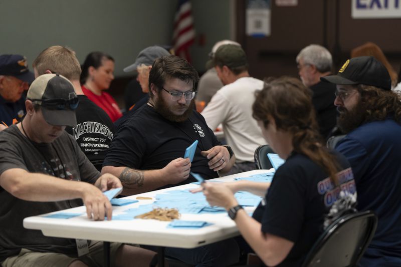 International Aerospace Machinists members count votes on a contract offer by airplane maker Boeing, on Thursday, Sept. 12, 2024, in Seattle. (AP Photo/Stephen Brashear)