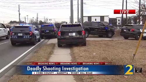 Marietta police are searching for a suspect in a deadly shooting near Windy Hill Road and Cobb Parkway on Wednesday afternoon.