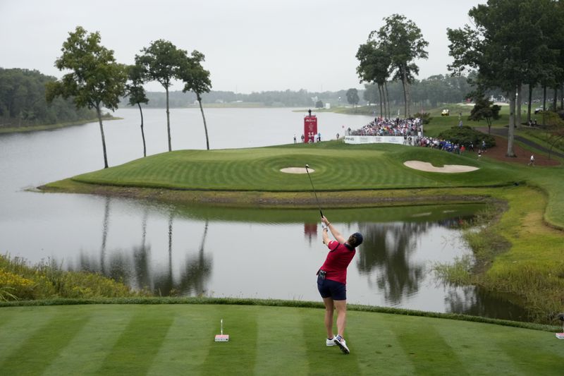 United States' Ally Ewing hits from the 11th tee during a Solheim Cup golf tournament foursomes match at Robert Trent Jones Golf Club, Friday, Sept. 13, 2024, in Gainesville, VA. (AP Photo/Matt York)