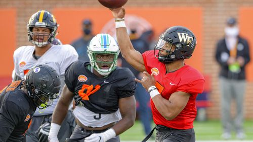 Jamie Newman throws during the American team practice for the NCAA Senior Bowl college football game in Mobile, Ala. (AP Photo/Matthew Hinton)