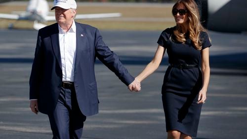 FILE - Republican presidential candidate Donald Trump, left, and his wife Melania arrive to a campaign rally, Nov. 5, 2016, in Wilmington, N.C. (AP Photo/ Evan Vucci, File)