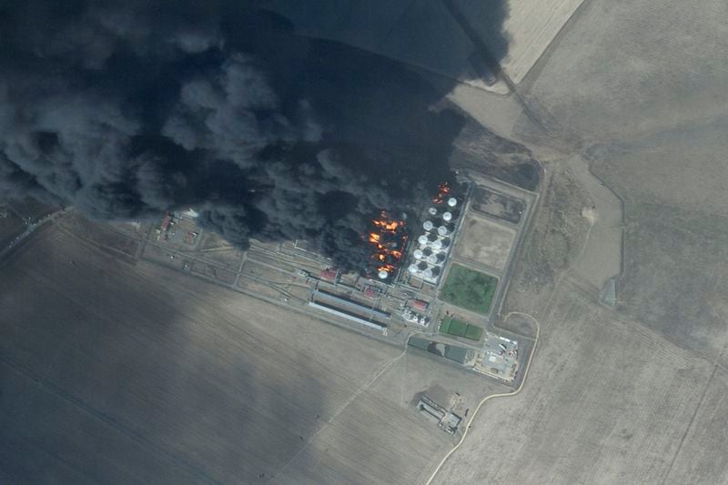 This satellite photo from Planet Labs PBC shows a fire at an oil depot earlier hit by a Ukrainian drone attack near Proletarsk, Russia, Monday, Aug. 19, 2024. (Planet Labs PBC via AP)