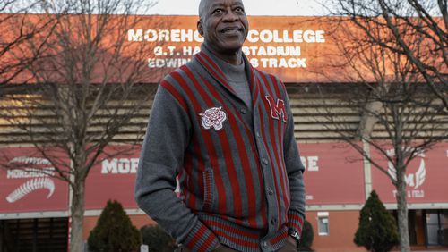 Olympian and Morehouse College alumnus Edwin Moses poses for a portrait in front of the track named after him on Wednesday, Jan. 17, 2024. (Natrice Miller/AJC)