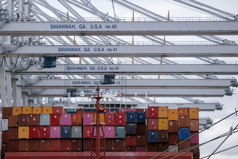 FILE - In this photo provided by the Georgia Ports Authority, a vessel is loaded with containers by several ship to shore crane at the Georgia Ports Authority's Port of Savannah Garden City Terminal, on Oct. 21, 2021, in Savannah, Ga. (Stephen B. Morton/Georgia Port Authority via AP, File)