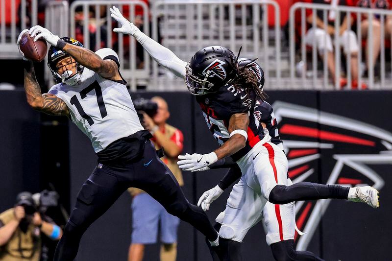 Jacksonville Jaguars tight end Evan Engram (17) makes a touchdown catch against Atlanta Falcons cornerback Kevin King (32) in the first half of an NFL preseason footballl game, Friday, Aug. 23, 2024, in Atlanta. (AP Photo/Butch Dill)