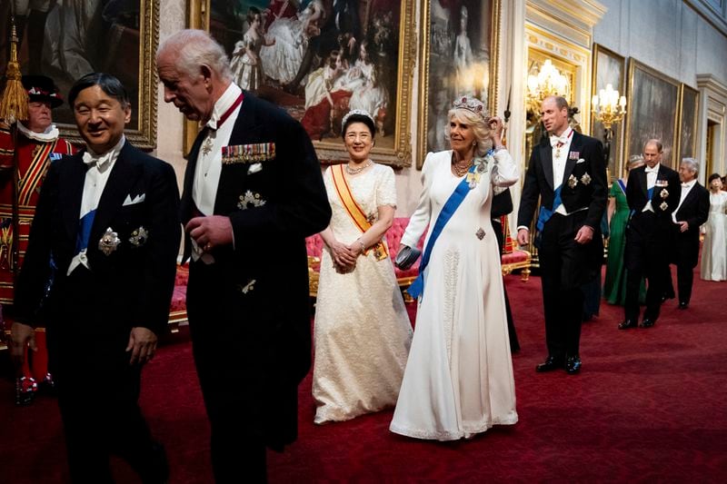 FILE - Britain's King Charles III, Emperor Naruhito, left, Empress Masako and Queen Camilla, right, make their way along the East Gallery to attend the State Banquet in London, Tuesday, June 25, 2024, during the State Visit of the Japanese Emperor and Empress to Britain. Naruhito and the Empress Masako, who studied at Oxford a few years after her husband, wrapped up a weeklong trip to Britain on Friday. Their itinerary combined the glitter and ceremony of a state visit with four days of less formal events that gave the royal couple an opportunity to revisit their personal connections to Britain. (Aaron Chown/Pool via AP, File)