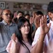 People take the oath of allegiance during a Naturalization ceremony at Jimmy Carter National Historic Park in Plains on Tuesday, Oct. 1, 2024. The ceremony was held in honor of President Carter’s 100th birthday.  Ben Gray for the Atlanta Journal-Constitution