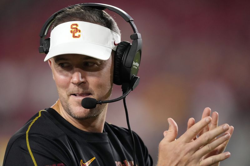 Southern California head coach Lincoln Riley claps after they scored a touchdown during the second half of an NCAA college football game against Utah State, Saturday, Sept. 7, 2024, in Los Angeles. (AP Photo/Mark J. Terrill)