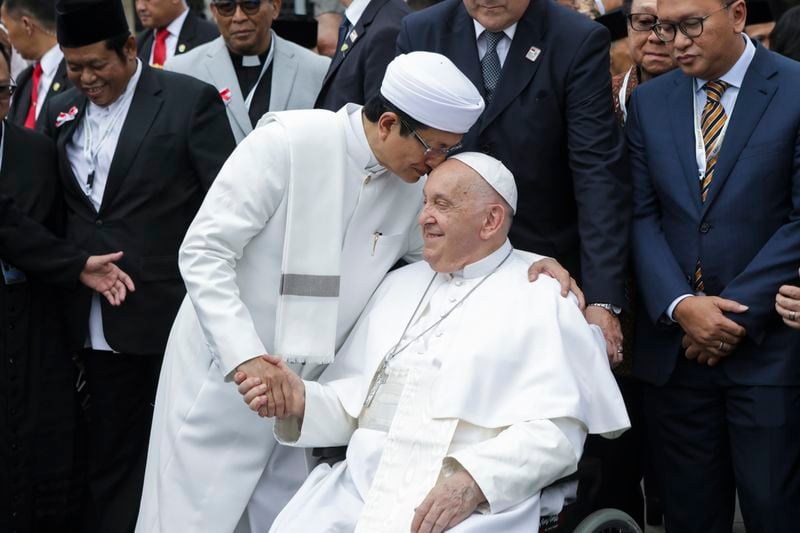 Pope Francis, right, and the Grand Imam of Istiqlal Mosque Nasaruddin Umar shakes hands during a family photo following an interreligious meeting with religious leaders at the Istiqlal Mosque in Jakarta, Thursday, Sept. 5, 2024. (Aditya Aji /Pool Photo via AP)