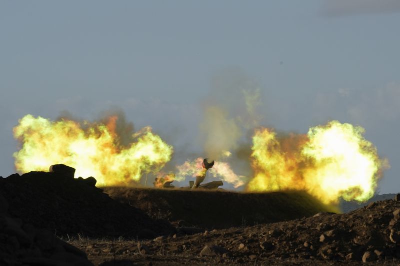 An Israeli mobile artillery unit fires a shell from northern Israel towards Lebanon, Wednesday, Oct. 2, 2024. (AP Photo/Baz Ratner)