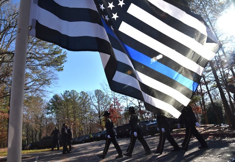 December 18, 2018 Dunwoody - Hundreds of police officers from around Georgia attend the funeral service of officer Edgar Isidro Flores at All Saints Catholic Church in Dunwoody on Tuesday, December 18, 2018. Flores was shot and killed in DeKalb County in the line of duty last week. HYOSUB SHIN / HSHIN@AJC.COM