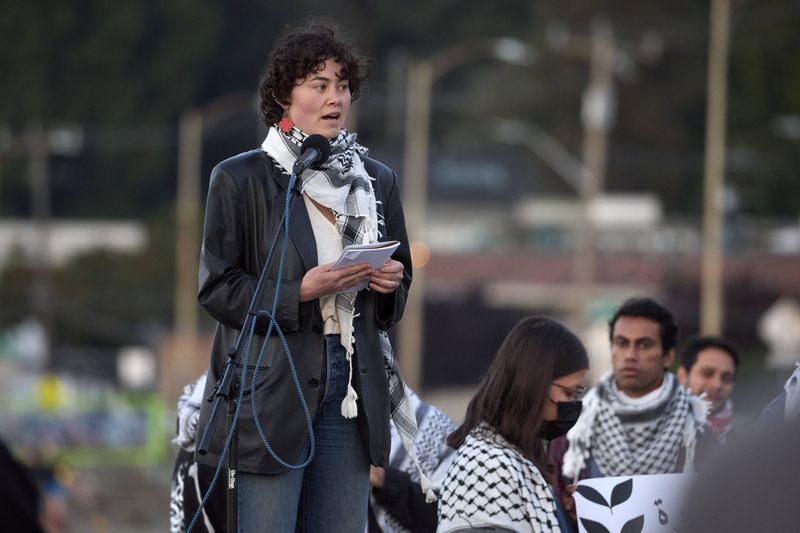 Zho Ragen, a friend of the 26-year old Aysenur Ezgi Eygi, killed recently in the occupied West Bank, during vigil on Alki Beach, Wednesday, Sept. 11, 2024, in Seattle. Eygi grew up in Seattle, attended Seattle Public Schools and graduated from the University of Washington. (AP Photo/John Froschauer)