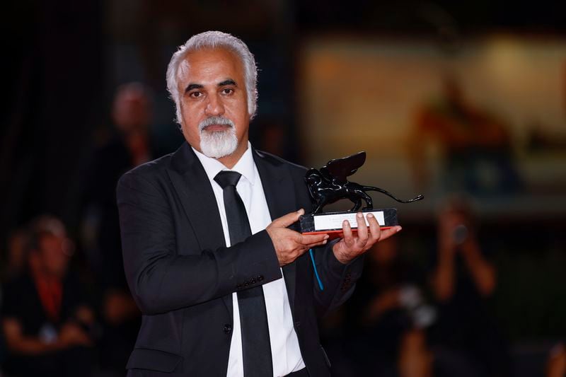 Director Nader Saeivar, winner of the armani beauty audience award for the film 'The witness', poses for photographers at the awards photo call during the closing ceremony of the 81st edition of the Venice Film Festival in Venice, Italy, on Saturday, Sept. 7, 2024. (Photo by Vianney Le Caer/Invision/AP)