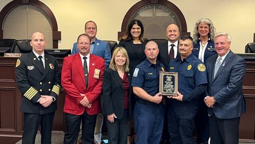 Roswell’s mayor, city council and Fire Chief Joe Pennino recently recognized firefighters Andrew Riley and James Laudermilk for receiving the 2023 Life Saving Valor Award by the Georgia State Firefighters Association. (Courtesy City of Roswell)