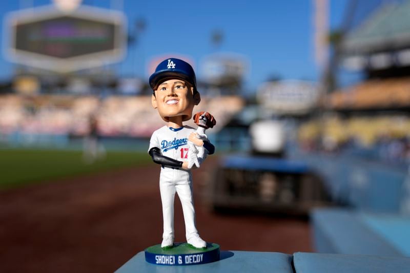 The bobblehead for Los Angeles Dodgers designated hitter Shohei Ohtani is seen prior to a baseball game between the Dodgers and the Baltimore Orioles, Wednesday, Aug. 28, 2024, in Los Angeles. (AP Photo/Mark J. Terrill)