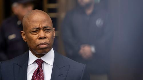 New York City mayor Eric Adams, right, appears outside Manhattan federal court after an appearance, Friday, Sept. 27, 2024, in New York. (AP Photo/Yuki Iwamura)