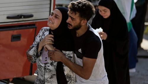 A woman reacts at the scene of an Israeli airstrike in the town of Maisara, north of Beirut, Wednesday, Sept. 25, 2024. (AP Photo/Bilal Hussein)