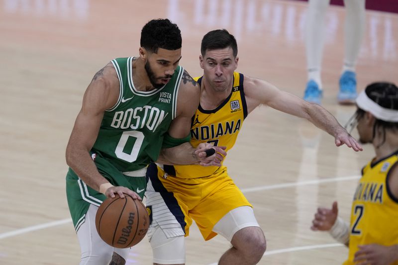 Boston Celtics forward Jayson Tatum (0) drives past Indiana Pacers guard T.J. McConnell during the first half of Game 3 of the NBA Eastern Conference basketball finals, Saturday, May 25, 2024, in Indianapolis. (AP Photo/Darron Cummings)
