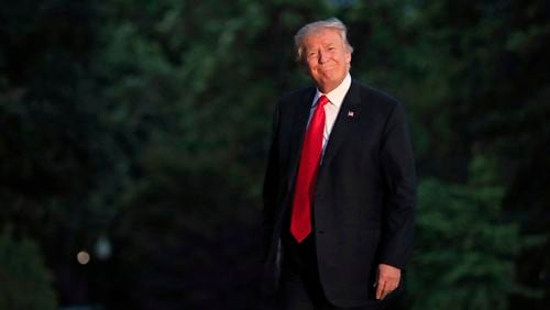 President Donald Trump smiles as he walks on the South Lawn upon arrival the White House in Washington, Saturday, July 8, 2017, from the G20 Summit in Hamburg, Germany. (AP Photo/Manuel Balce Ceneta)