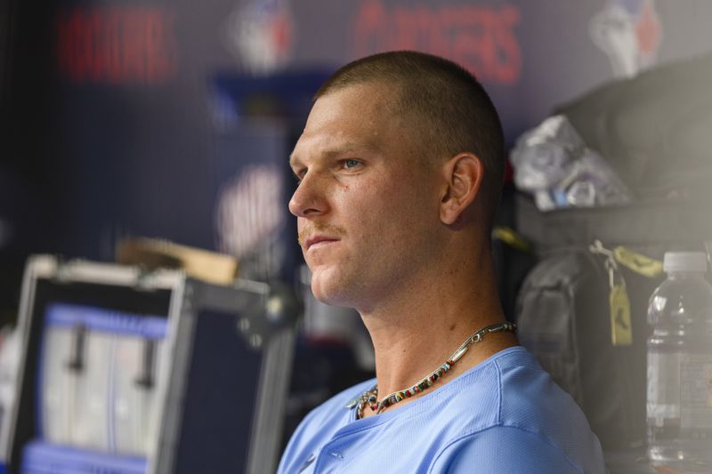 Toronto Blue Jays pitcher Bowden Francis looks on from the dugout in the ninth inning of a baseball game against the Los Angeles Angels in Toronto, Saturday, Aug. 24, 2024. (Christopher Katsarov/The Canadian Press via AP)