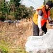 Lifelong Pleasant Hill neighborhood resident Antonio Williams picks up trash at the corner of Roosevelt Ave. and Willis Lane. Macon Mayor Lester Miller announced a new initiative to focus on data-driven neighborhood cleanups in Macon. (Photo Courtesy of Jason Vorhees/The Telegraph)