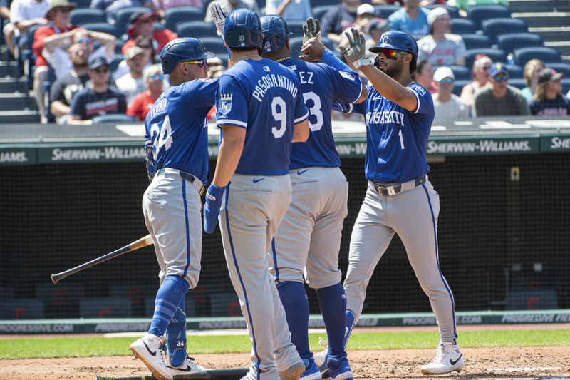 Kansas City Royals' MJ Melendez (1) is greeted by Freddy Fermin, left, Vinnie Pasquantino (9) and Salvador Perez, center right, after his three-run home run off Cleveland Guardians relief pitcher Eli Morgan during the fourth inning of the first game of a baseball doubleheader in Cleveland, Monday, Aug. 26, 2024. (AP Photo/Phil Long)