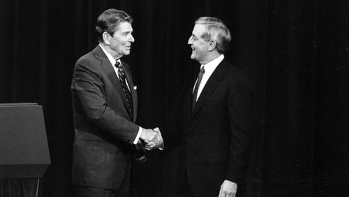 FILE - President Ronald Reagan, left, and his Democratic challenger Walter Mondale, shake hands before debating in Kansas City, Mo., Oct. 22, 1984. The age question for presidential candidates is more than four decades old. (AP Photo/Ron Edmonds, File)