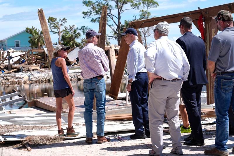 President Joe Biden speaks with Sen. Rick Scott, R-Fla., in Keaton Beach, Fla., Thursday, Oct. 3, 2024, during his tour of areas impacted by Hurricane Helene. (AP Photo/Susan Walsh)