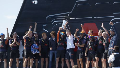 INEOS Britannia's team celebrate their victory against the Luna Rosa Prada Pirelli's sailing team during the Louis Vuitton Cup Final Day 7 at the Barcelona's coast, Spain, Friday, Oct. 4, 2024. (AP Photo/Joan Monfort)