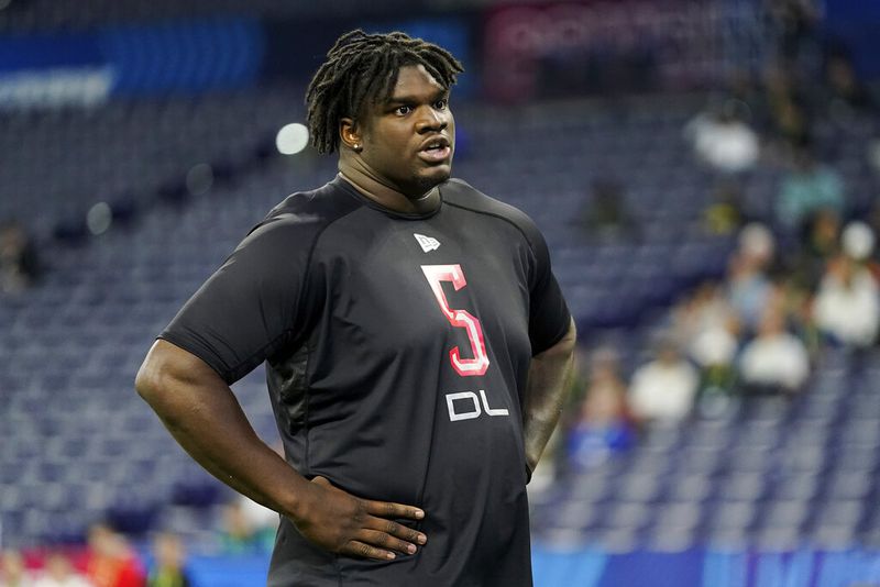Georgia defensive lineman Jordan Davis (05) walks on the field at the NFL football scouting combine in Indianapolis, Saturday, March 5, 2022. (AP Photo/Steve Luciano)