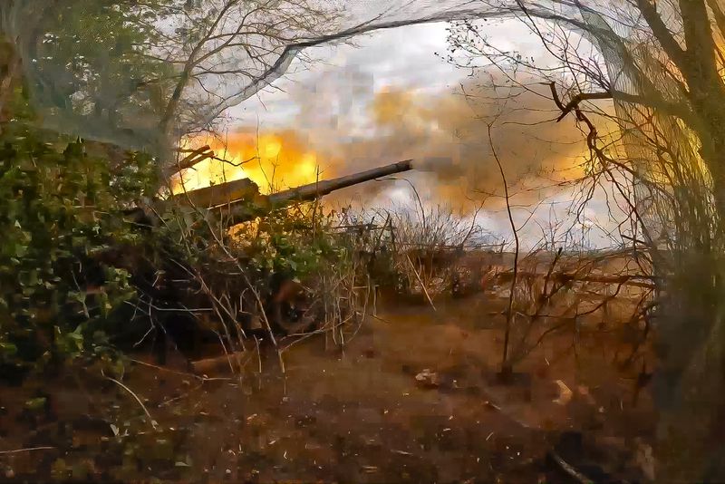 In this photo taken from video released by Russian Defense Ministry Press Service on Wednesday, July 3, 2024, Russian soldiers fire from their 152-mm «Giatsint-B» howitzer from their position at Ukrainian troops at an undisclosed location in Ukraine. (Russian Defense Ministry Press Service via AP)