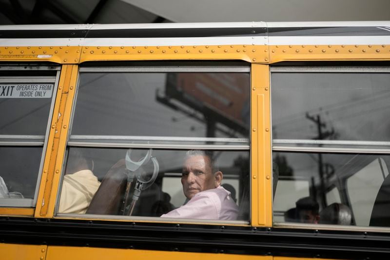 Manuel Rios peers from a bus after being released from a Nicaraguan jail and landing at the airport in Guatemala City, Thursday, Sept. 5, 2024. (AP Photo/Moises Castillo)