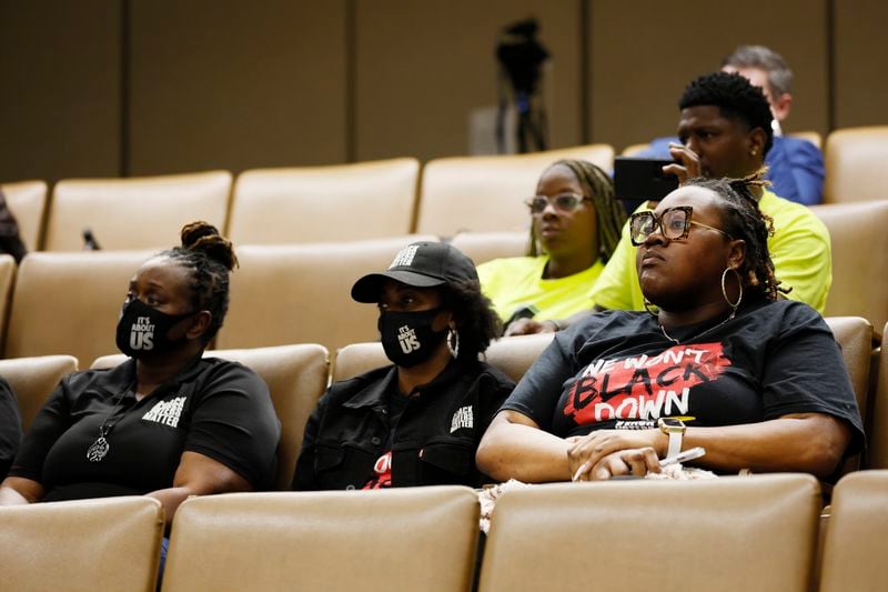 Black Voters Matter members listen during a Georgia State Elections board meeting Tuesday at Mercer University in Macon. Miguel Martinez / miguel.martinezjimenez@ajc.com 