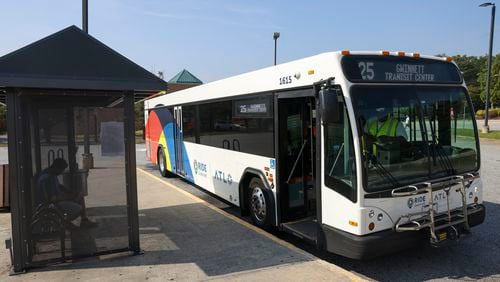 A Ride Gwinnett bus picks-up passengers at the Gwinnett County Transit Center off of Satellite Boulevard, Tuesday, September 12, 2023, in Duluth, Ga. (Jason Getz / Jason.Getz@ajc.com)