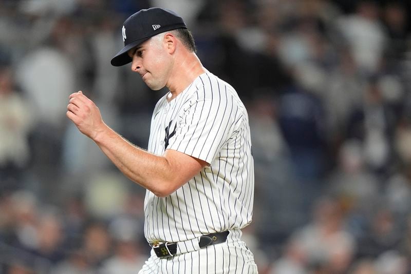 New York Yankees pitcher Carlos Rodón reacts as he walks off the field during the fourth inning of Game 2 of the American League baseball playoff series against the Kansas City Royals, Monday, Oct. 7, 2024, in New York. (AP Photo/Frank Franklin II)