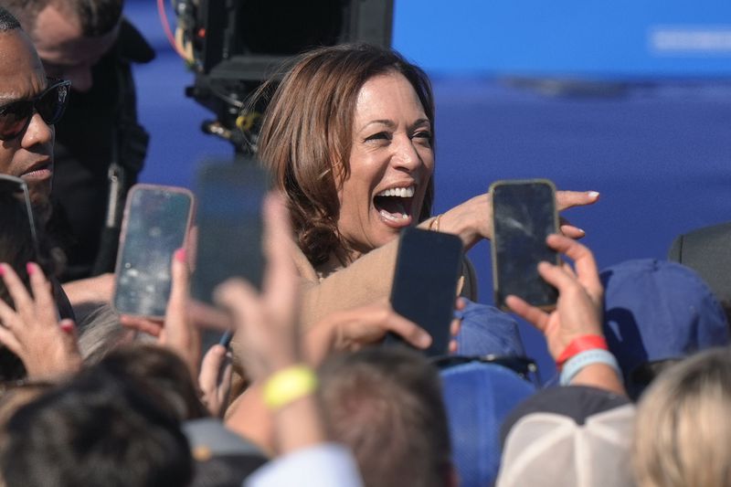 Democratic presidential nominee Vice President Kamala Harris greets people after speaking during a campaign stop at the Throwback Brewery, in North Hampton, N.H., Wednesday, Sept. 4, 2024. (AP Photo/Steven Senne)