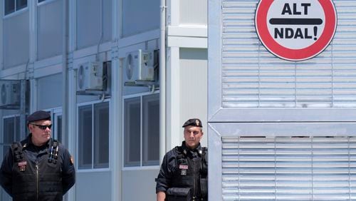 FILE- Police guard a reception center for migrants, at the port of Shenjin, northwestern Albania, on Wednesday, June 5, 2024. (AP Photo/Vlasov Sulaj, File)