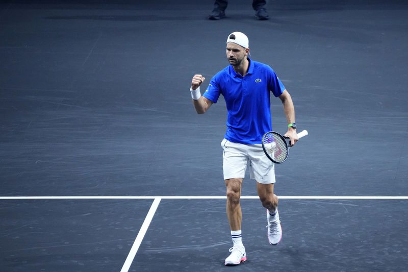 Team Europe's Grigor Dimitrov reacts during his singles tennis match against team World's Alejandro Tabilo on the first day of the Laver Cup tennis tournament at the Uber arena in Berlin, Germany, Friday, Sept. 20, 2024. (AP Photo/Ebrahim Noroozi)