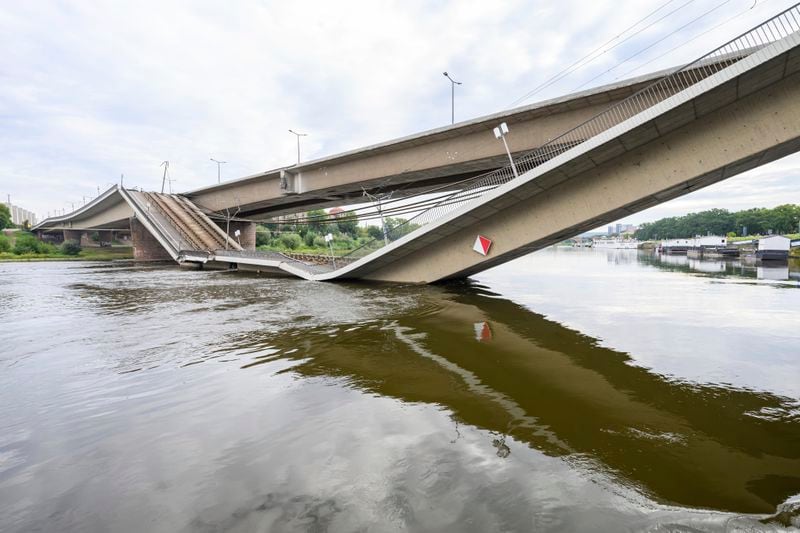 Parts of the Carola Bridge over the Elbe have collapsed in Dresden, Germany, Wednesday, Sept. 11, 2024. (Robert Michael/dpa via AP)