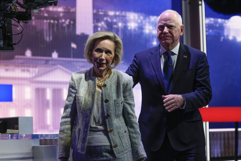 Democratic vice presidential candidate Minnesota Gov. Tim Walz and his wife Gwen Walz walk from stage after a vice presidential debate with Republican vice presidential nominee Sen. JD Vance, R-Ohio, hosted by CBS News, Tuesday, Oct. 1, 2024, in New York. (AP Photo/Matt Rourke)