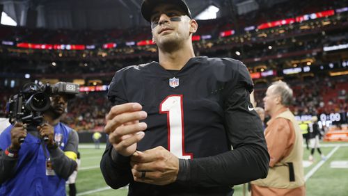 Falcons quarterback Marcus Mariota walks off the field after a heartbreaking loss against the Steelers on Sunday at Mercedes-Benz Stadium. (Miguel Martinez / miguel.martinezjimenez@ajc.com)