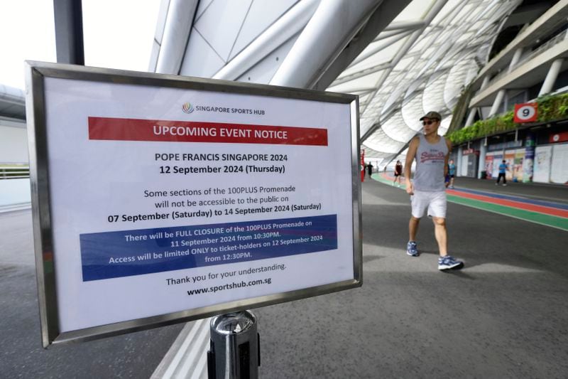 An event notice is seen outside the National Stadium ahead of the visit of Pope Francis in Singapore, Sunday, Sept. 8, 2024. (AP Photo/Suhaimi Abdullah)