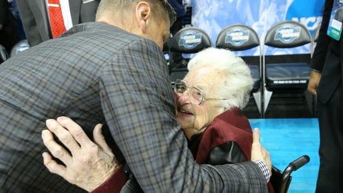 Loyola head coach Porter Moser hugs team chaplain Sister Jean Dolores Schmidt after beating Nevada 69-68 in the South Regional semifinal Thursday night at Philips Arena.