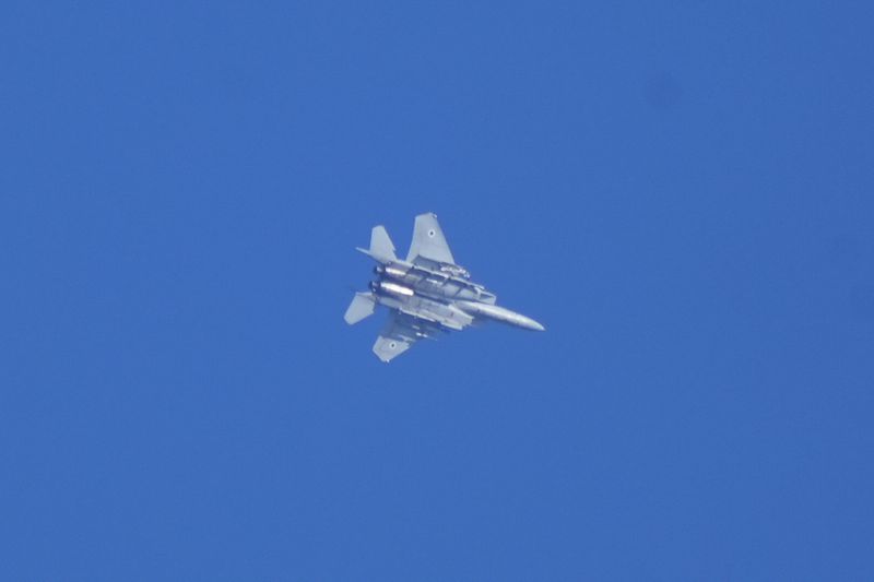 An Israeli fighter jet is seen from Haifa, northern Israel, on Thursday, Sept. 26, 2024. (AP Photo/Baz Ratner)