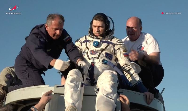 In this photo taken from video released by Roscosmos space corporation, rescue team members help Roscosmos cosmonaut Nikolai Chub to get from the capsule shortly after the landing of the Russian Soyuz MS-25 space capsule carrying NASA astronaut Tracy Dyson, Roscosmos cosmonauts Oleg Kononenko and Nikolai Chub, south-east of the Kazakh town of Zhezkazgan, Kazakhstan, Monday, Sept. 23, 2024. (Roscosmos space corporation via AP)