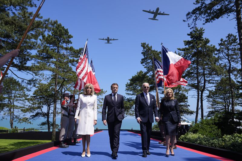 Left to right: Brigitte Macron, French President Emmanuel Macron, President Joe Biden and first lady Jill Biden, mark the 80th anniversary of D-Day in Normandy. 