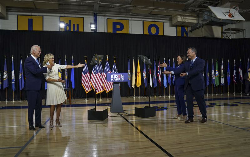 Presumptive Democratic presidential nominee Joe Biden and wife Jill greet Kamala Harris and husband Doug Emhoff at a campaign event in Wilmington, Delaware, in August 2020. (Photo: Toni L. Sandys / Washington Post)