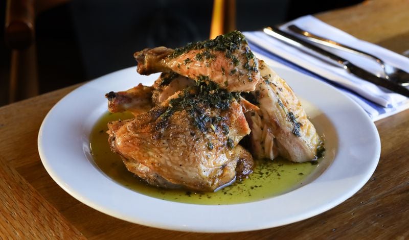 Roasted chicken with jalapeno salsa verde from the menu of Adele's.
