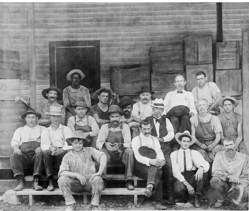 Pioneering Black master distiller 'Uncle' Nearest Green poses with Jack Daniel (left of Green) and the Jack Daniel's Whiskey crew.