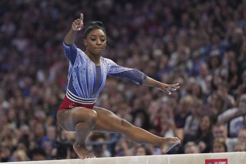 Simone Biles competes on the balance beam at the United States Gymnastics Olympic Trials on Friday, June 28, 2024 in Minneapolis. (AP Photo/Abbie Parr)